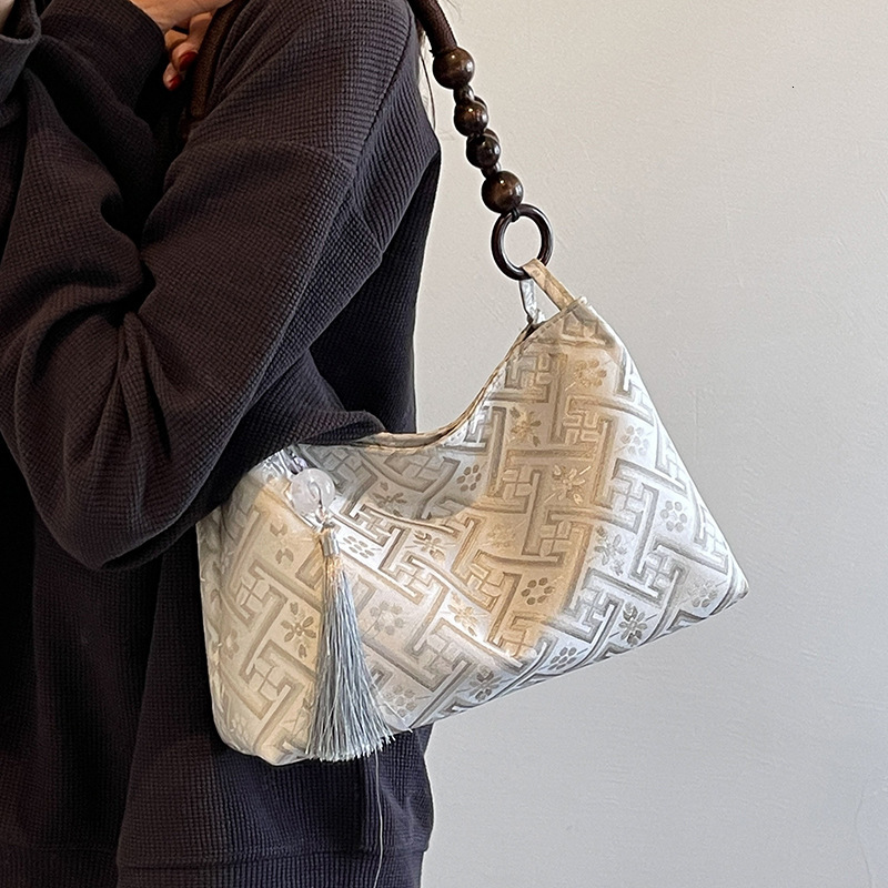 2025 new summer niche Chinese women's bag, new multi-functional commuting single shoulder designer armpit bag, Chinese style light luxury hand-he