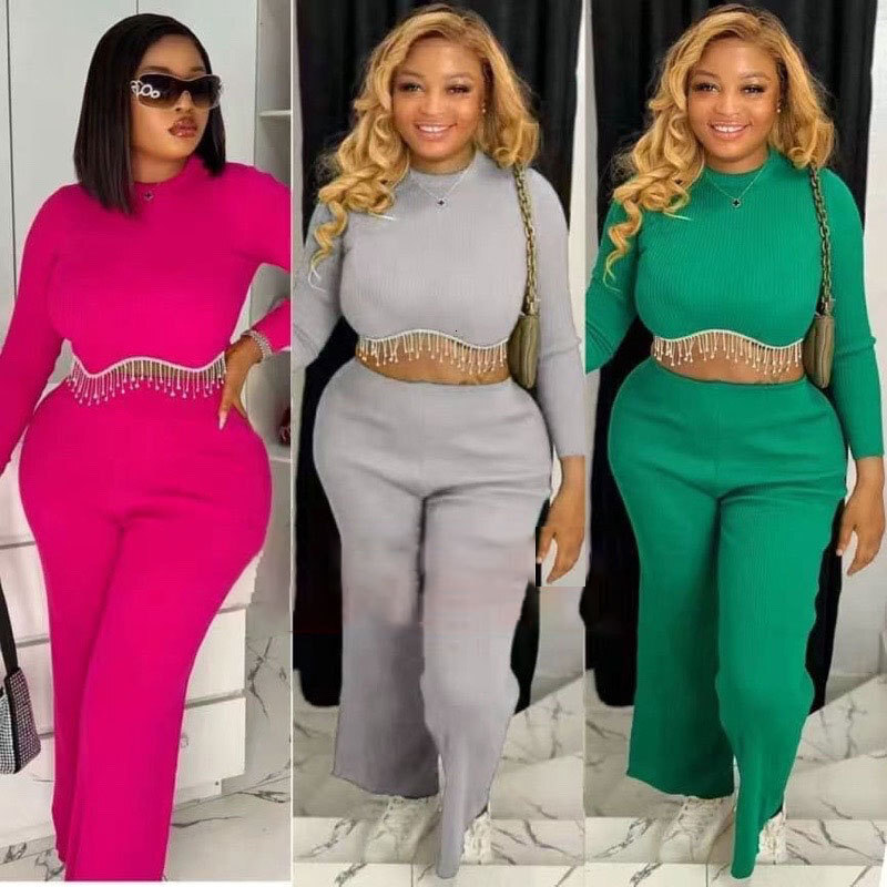 Womens new spliced chain round neck exposed waist long sleeved top straight leg pants set