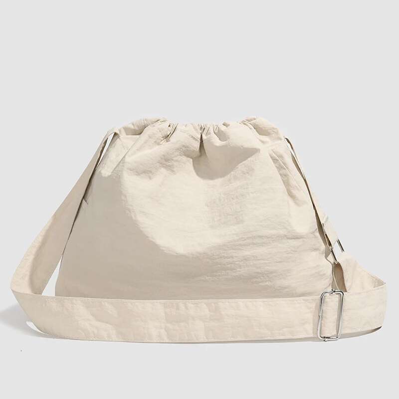 Large capacity drawstring sports wind dumpling new lightweight small niche tote commuting versatile shoulder bag cross-b