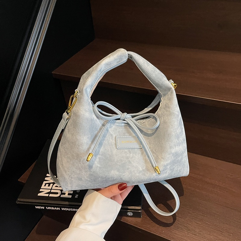 Large capacity women's summer versatile 2025 new niche design, simple crossbody bag, hand-held commuting dumpling bag