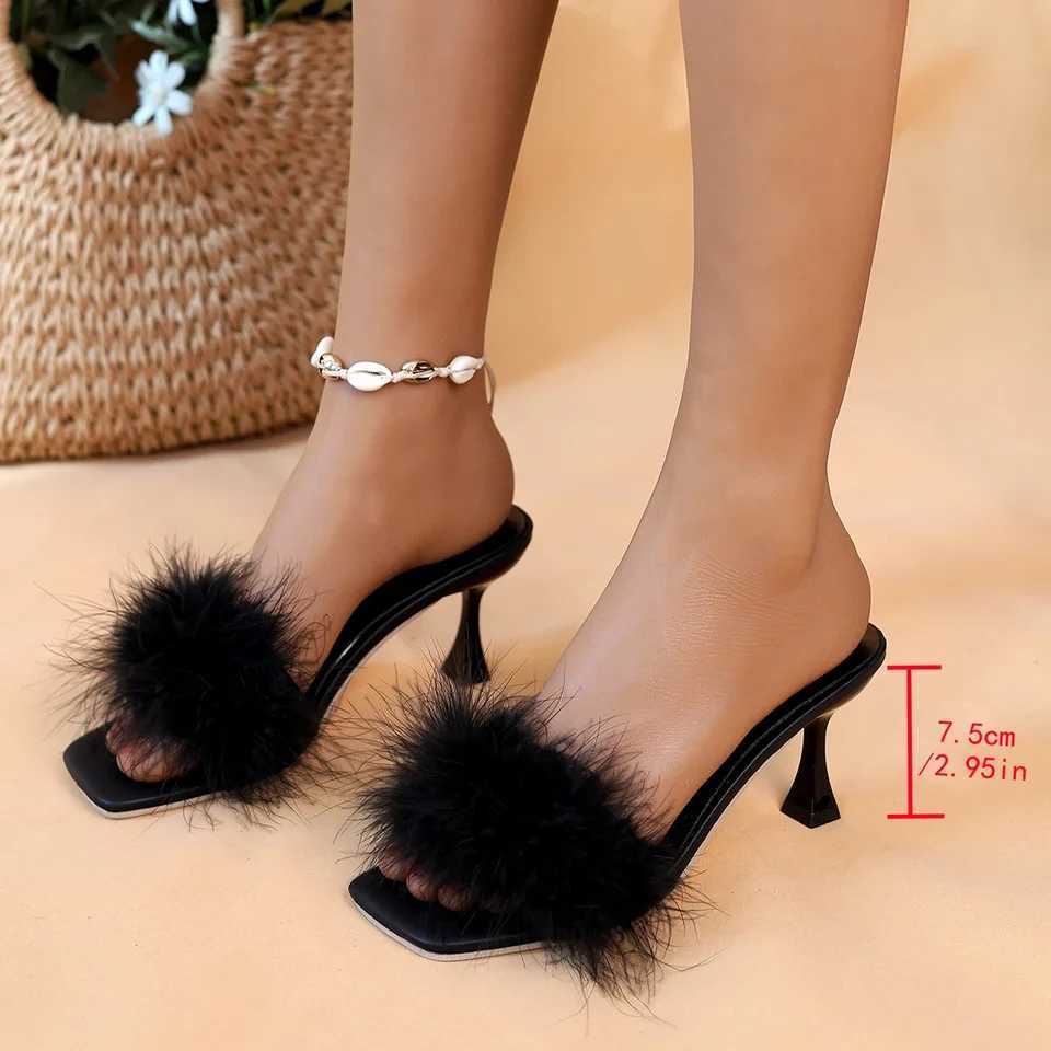 A pair of black womens casual high heels with soft chicken hair design and black high-heeled sandals W250514
