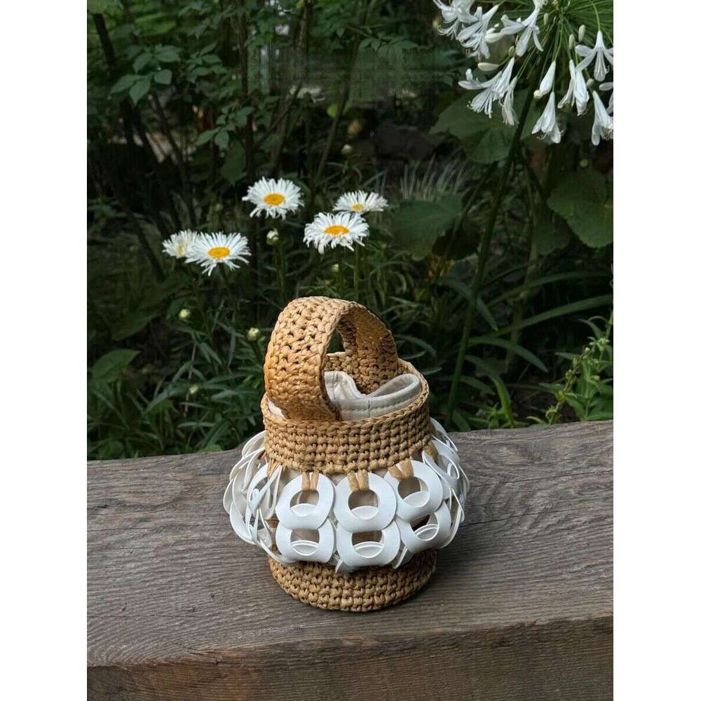 The Handcrafted, Nature-Inspired Woven Straw Bucket Bag With Intricate Cutouts