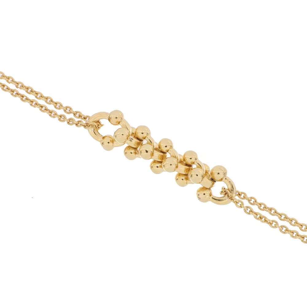 Made in Italy gold bracelet with double chains and bead accents, adjustable length, elegant design
