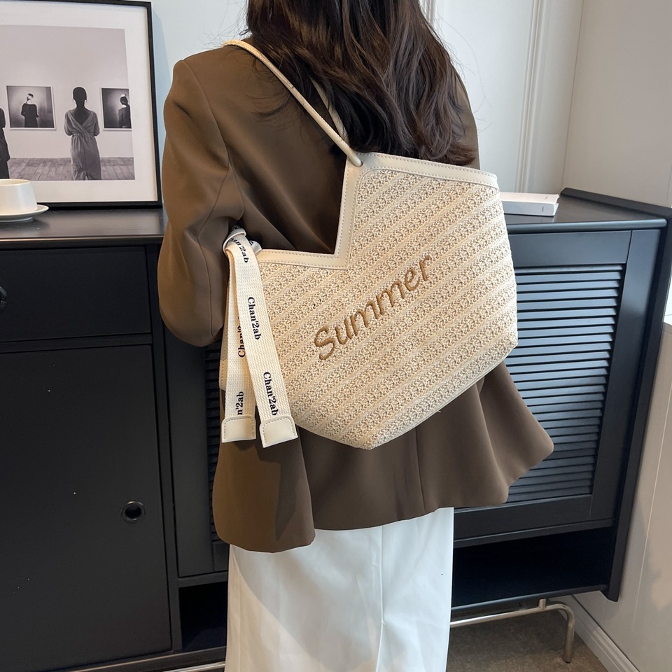 Summer large capacity 2025 new grass women's niche design shoulder versatile woven tote bag