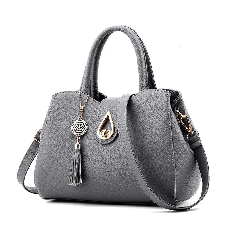 Simple women's fashion casual handbag large capacity fringed decorative shoulder messenger bag