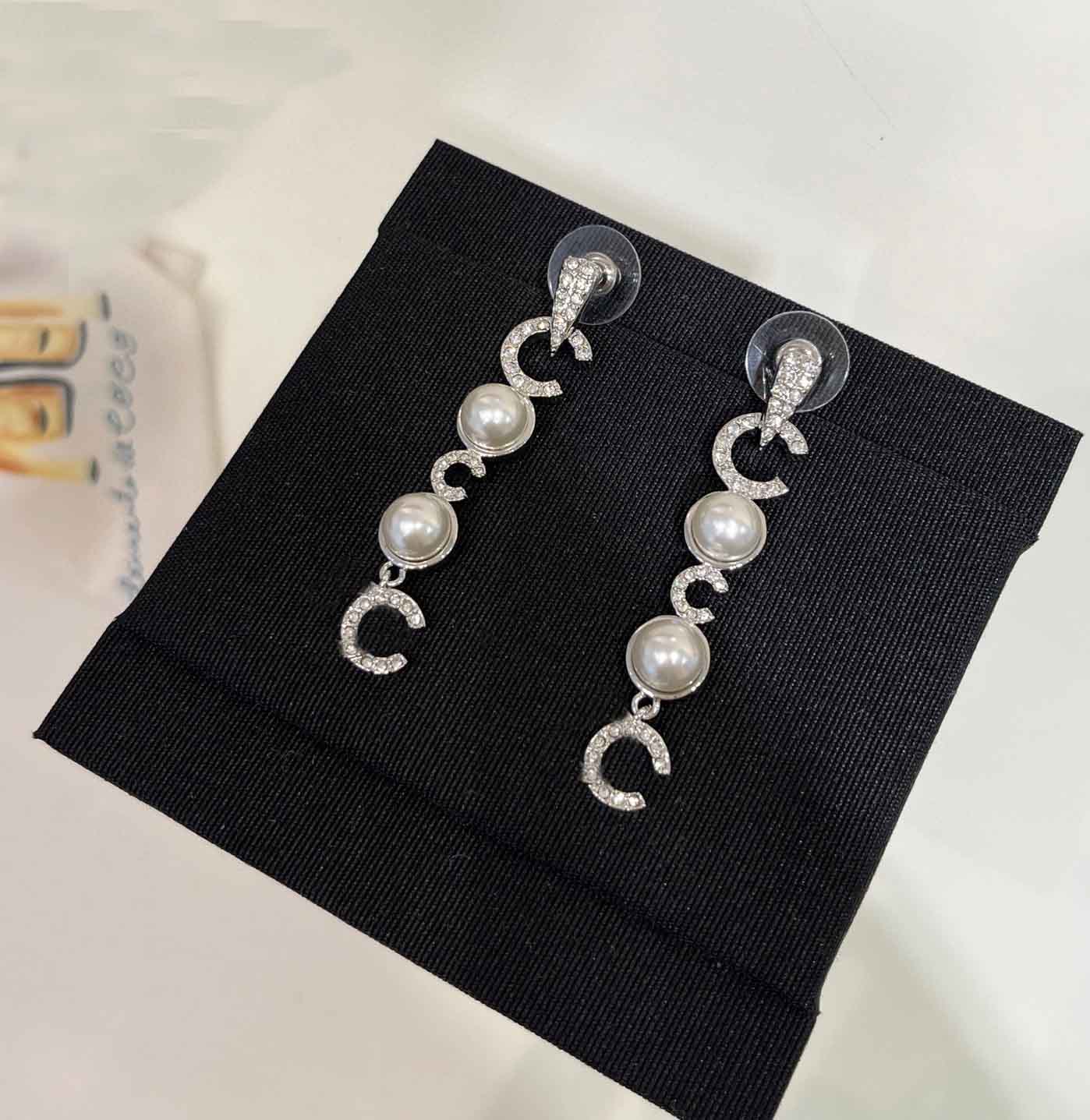 2025 Luxury quality charm drop earring with diamond and white shell beads in silver plated have stamp box PS6606A