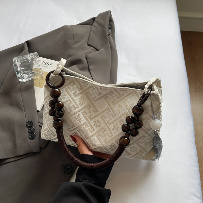 2025 new summer niche Chinese women's bag, new multi-functional commuting single shoulder designer armpit bag, Chinese style light luxury hand-he