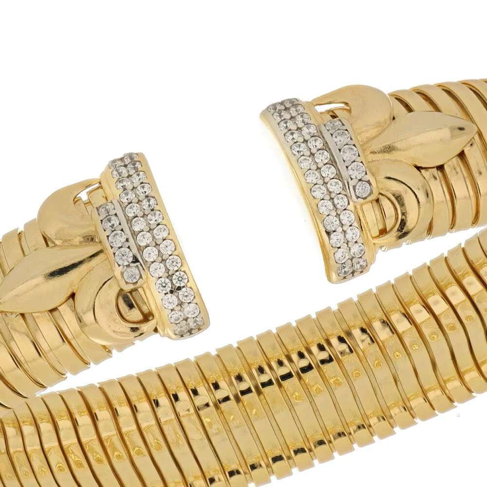 Made in Italy, luxurious handmade gold cuff bracelet with leaf decoration and sparkling microcrystalline CZ, elegant