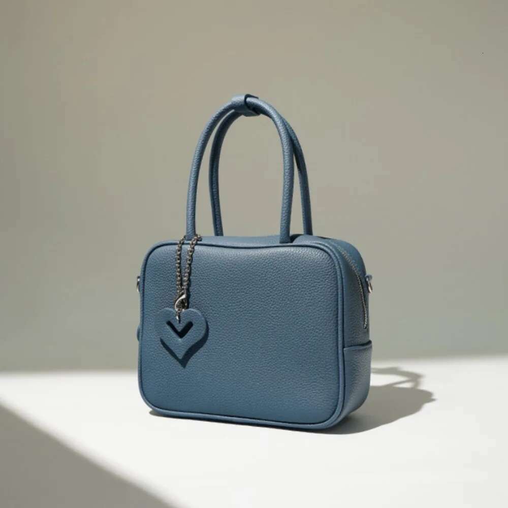 Designer Bag 2025 Elegant Solid Texture Commuter Roft Crossbody Bags Lovely Pendant Braid Sweet Exquisite Shoulder New Moda Women Handbags Luxury Bag
