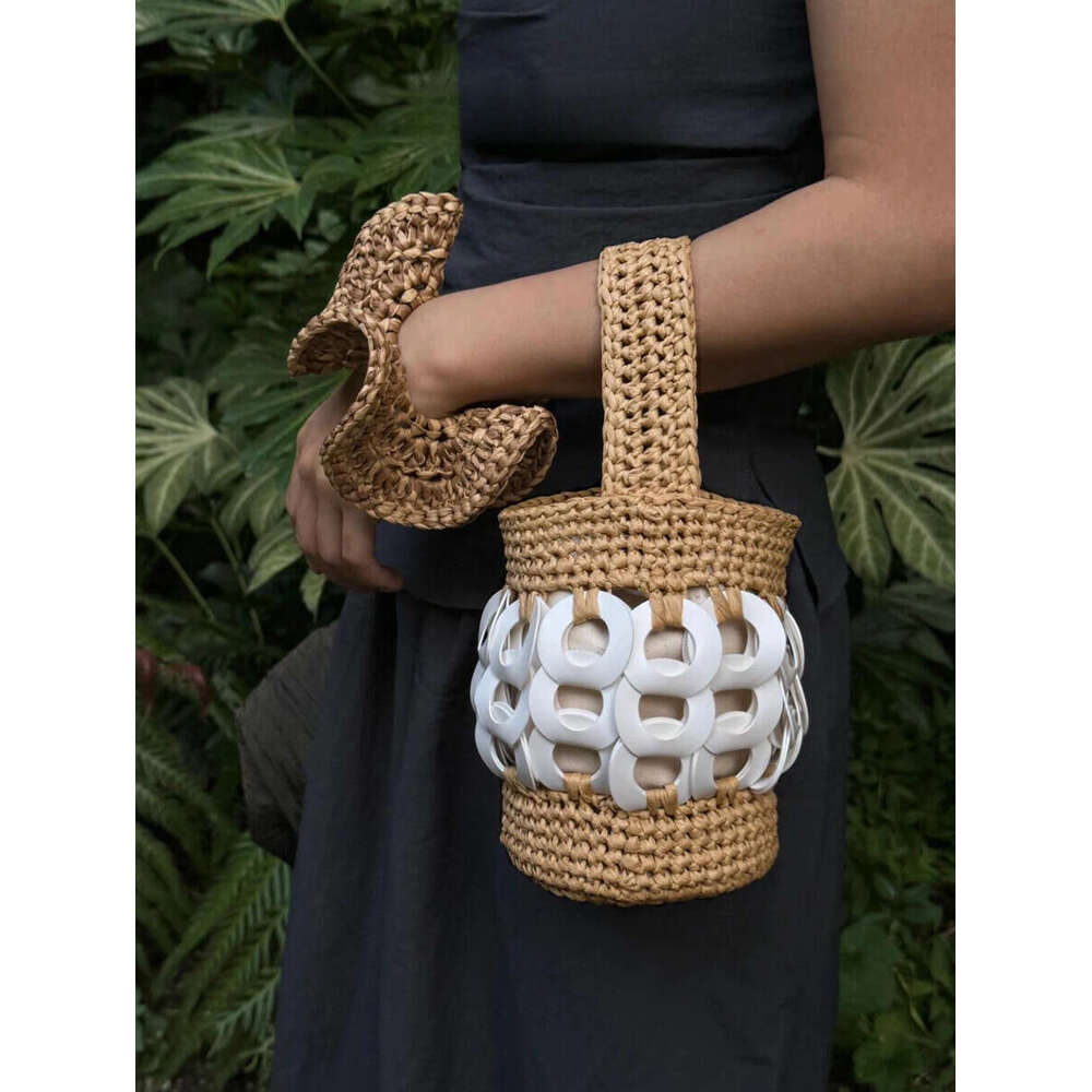 The Handcrafted, Nature-Inspired Woven Straw Bucket Bag With Intricate Cutouts
