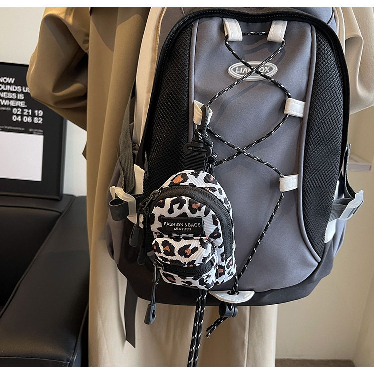 2025 Designer Bag New Fashionable Lipstick Headphone Storage Mini Bag Pendant Bag Niche Design Spotted Ripple Single Shoulder Crossbody Bag Unisex