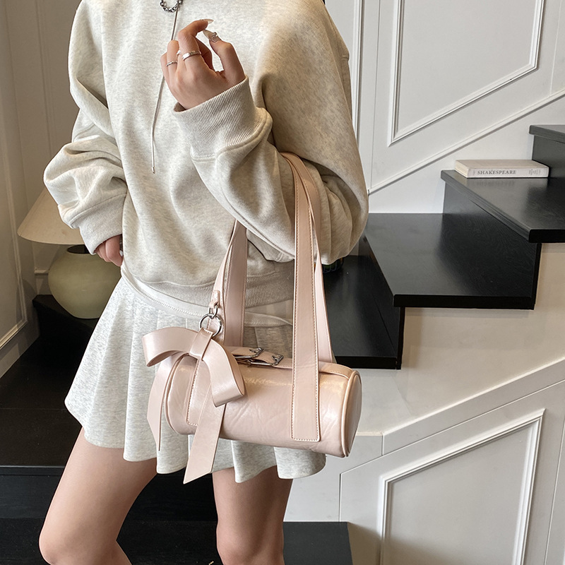Niche bow hand-held small for women 2025 new trendy and fashionable texture armpit bag, summer minimalist baguette bag