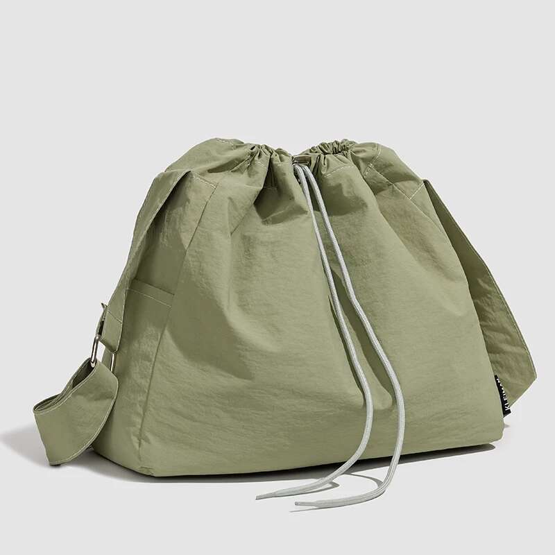 Large capacity drawstring sports wind dumpling new lightweight small niche tote commuting versatile shoulder bag cross-b