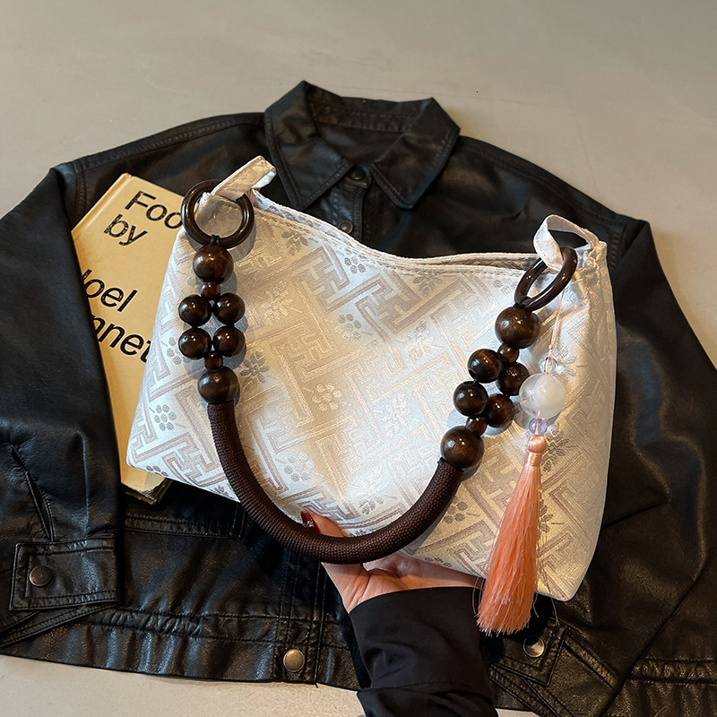 2025 new summer niche Chinese women's bag, new multi-functional commuting single shoulder designer armpit bag, Chinese style light luxury hand-he