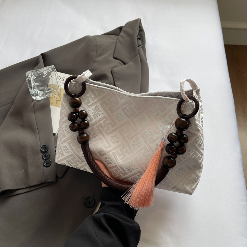 2025 new summer niche Chinese women's bag, new multi-functional commuting single shoulder designer armpit bag, Chinese style light luxury hand-he
