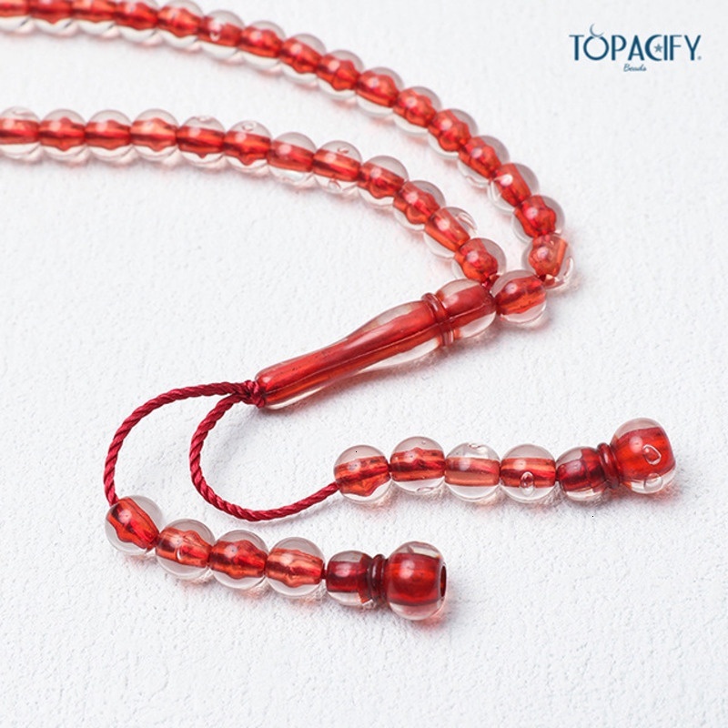 Handstring Cook holding 66 beads of praise, prayer beads, Muslim accessories
