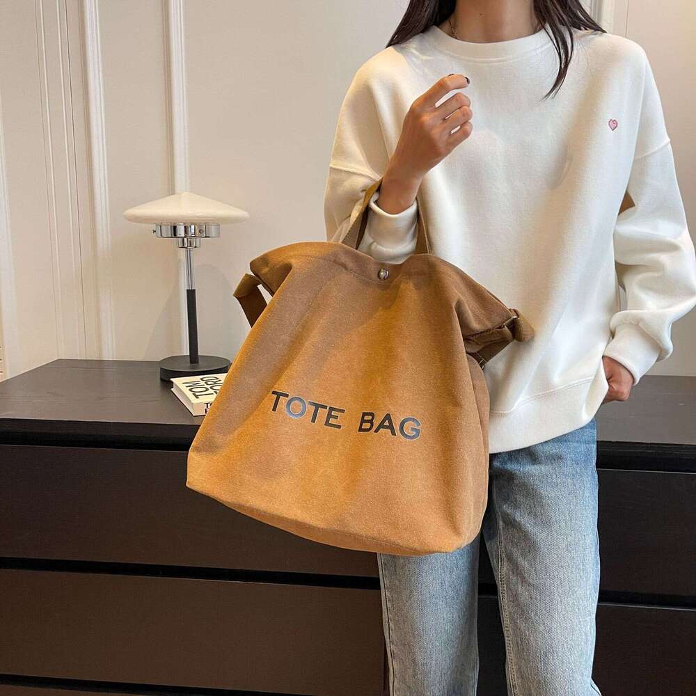 Thick canvas vintage tote high-end handbag commuting large capacity student backpack shoulder bag 2025 new style chic and elegant temperament