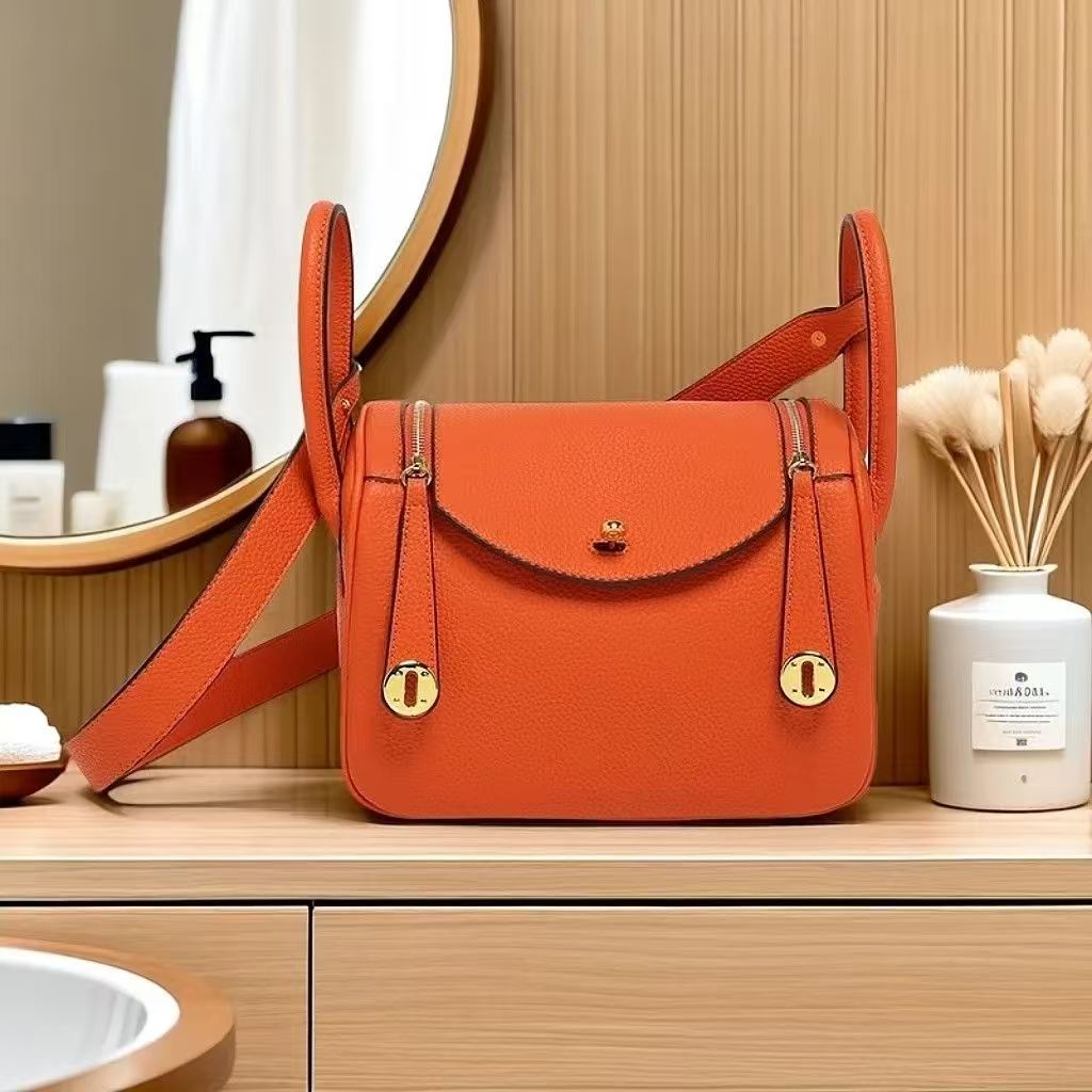2025 new lychee grain cowhide womens bag large leather single shoulder crossbody bag silver buckle pillow tote bag versatile commuter handbag