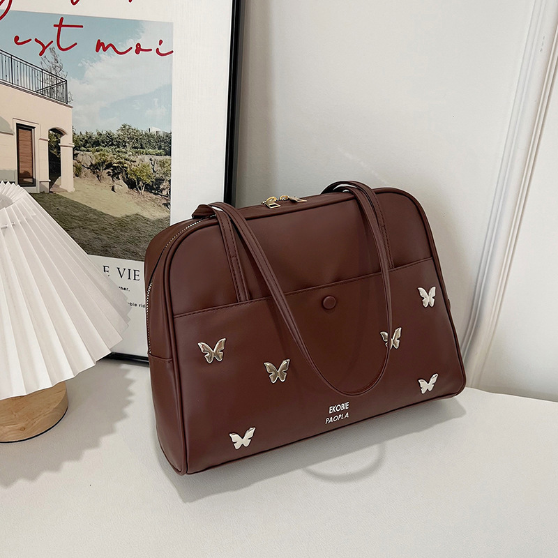 2025 Spring And Summer New Tote Fashion Trend New Free Delivery Designer Bag Pillow Handheld Shoulder This Year's Luxury Bag Popular Women's