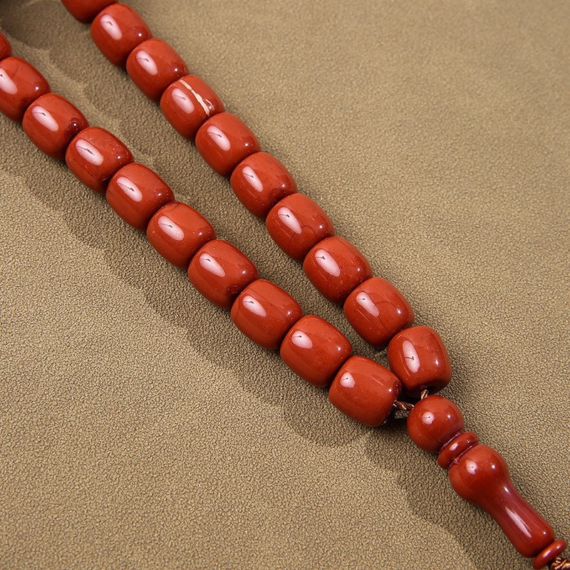 Cylindrical Buddhist with Cook holding 33 praise beads, Muslim prayer bead bracelet