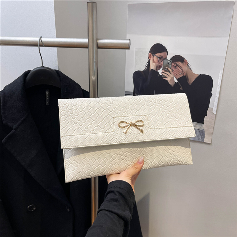 2025 New Urban Simple Fashion Trendy Bow New Free Delivery Designer Bag Luxury Bag Stone Pattern Bright Face Single Shoulder Underarm Small Square Wom