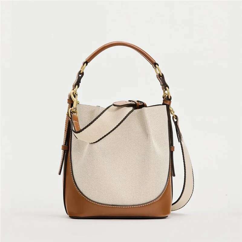 New women's brown pleated drawstring versatile hand-held bucket wide shoulder strap diagonal cross bag