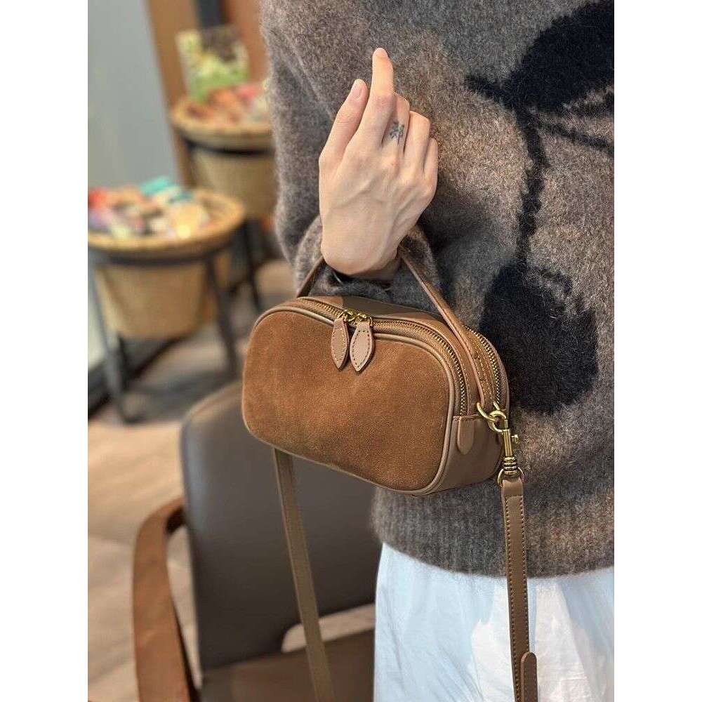 Small handbag 2025 new niche crossbody hand-held fashionable cowhide versatile leather women's bag