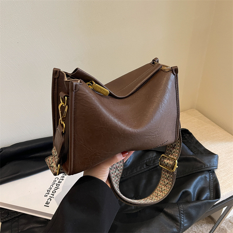 2025S designer French three-dimensional small women versatile new fashion commuting broadband shoulder crossbody pillow bag