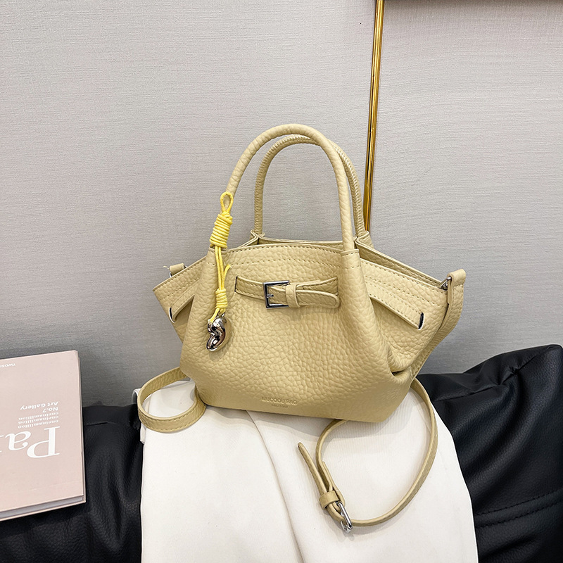 New high-end texture spring and summer fashionable drawstring dumplings handheld women's shoulder bag solid color casual fashion handbag lychee p