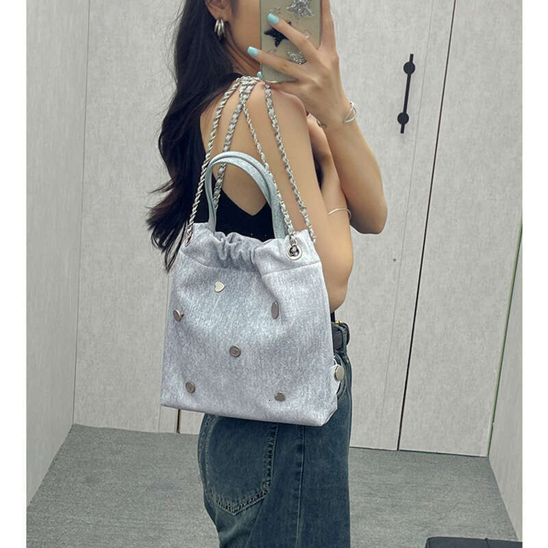 Small backpack with niche design, denim leather chain women's 2025 Korean version, casual backpack, hand-held, single shoulder, new style, unique