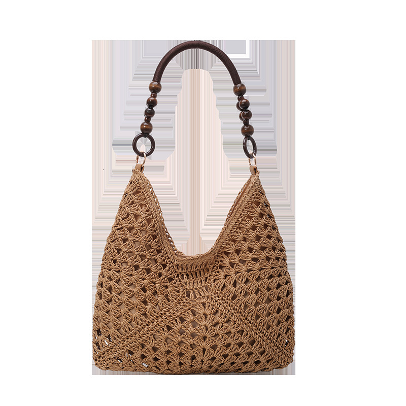 Hollow out fashionable casual grass armpit women 2025 summer new large capacity woven shoulder bag for work and commuting
