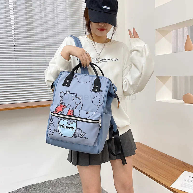 Disney 2025 New Winnie The Pooh Diaper Bag Backpack Cartoon Cute Mother and Baby Bag Large Capacity Lightweight Travel Mommy BagXJ250515