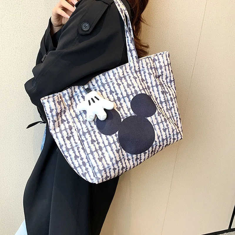 Disney New Womens Canvas Handbag Large Capacity Shoulder Bag Cute Armpit Mommy Niche Shopping BagXJ250515