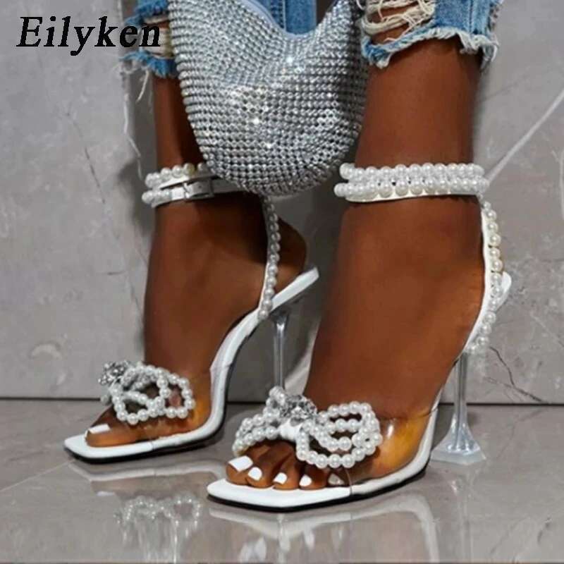 Eilyken New Women Sandals 2025 Summer Sexy Perspex Crystal High Heels Party Wedding Shoes Square Toe Pearls String Bowknot Pumps