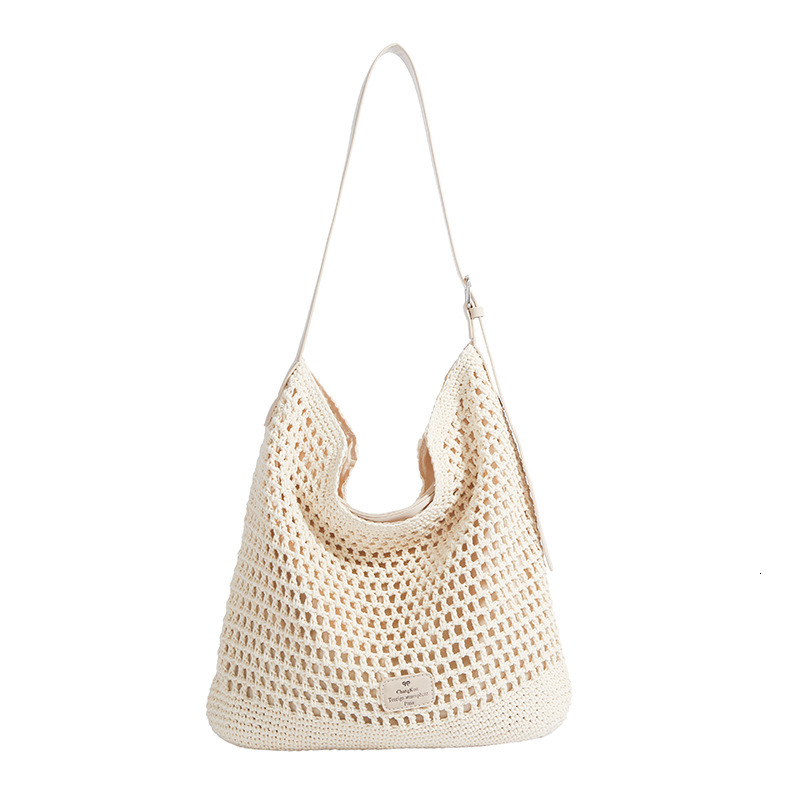 2025 new hollow woven large capacity forest lazy feng shui bucket for women, simple vacation style single shoulder crossbody bag
