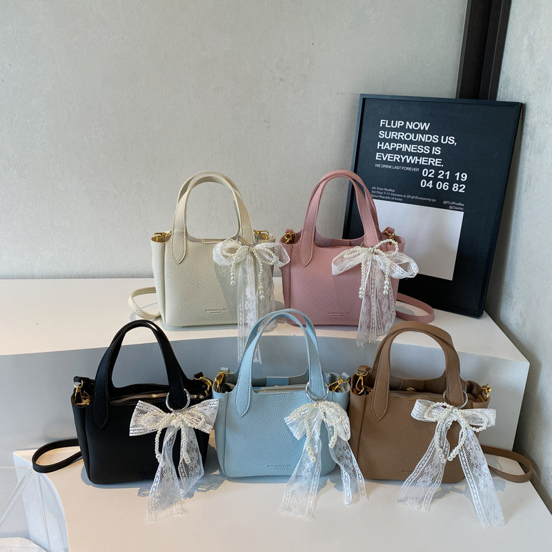New high-end women's simple handbag for spring and summer with lychee pattern bow and ribbon designer single shoulder crossbody bag commuting sol