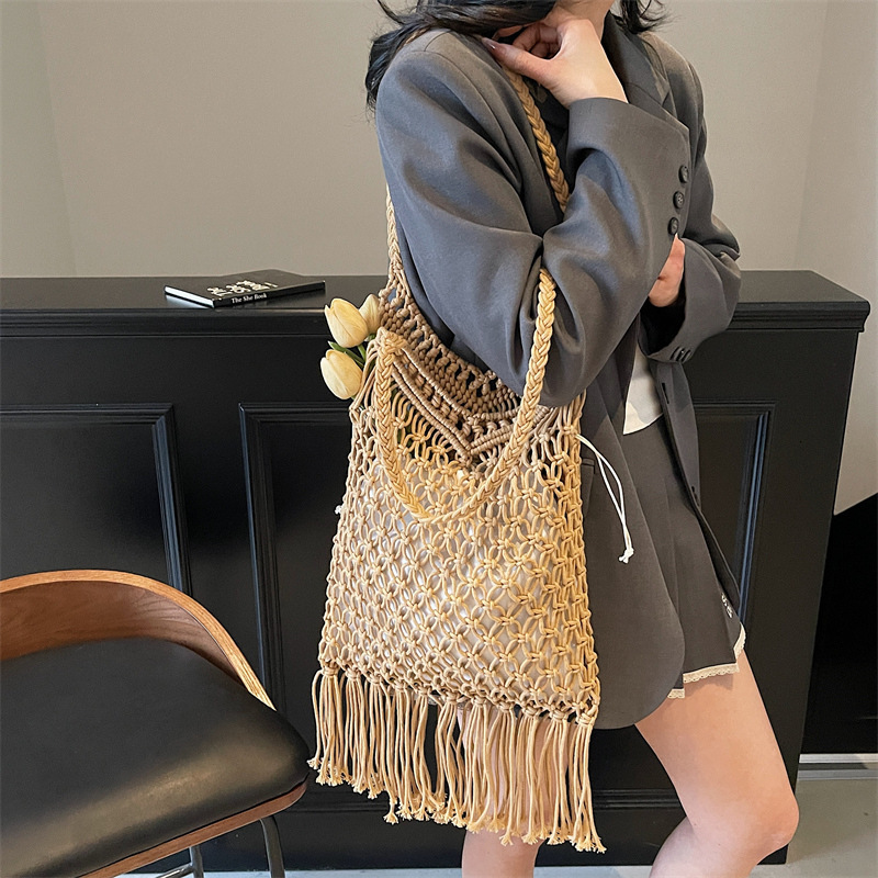 Hollow out cotton thread for women 2025 summer new tassel grass woven bag, vacation style beach versatile armpit shoulder bag