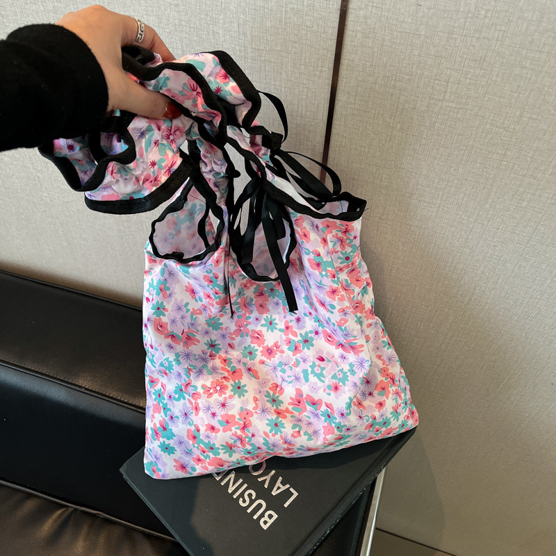 2025 New Sweet And Cute Folded Shoulder Summer Small Fresh Wave Point Bow Luxury Bag Cloth New Free Delivery Designer Bag Commuter Bag For Women