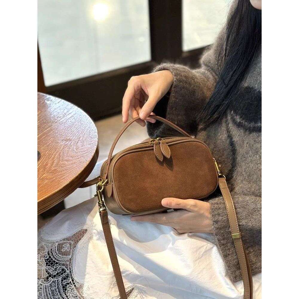 Small handbag 2025 new niche crossbody hand-held fashionable cowhide versatile leather women's bag