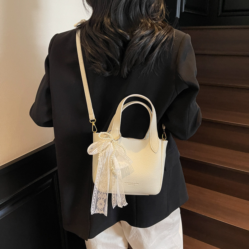 New high-end women's simple handbag for spring and summer with lychee pattern bow and ribbon designer single shoulder crossbody bag commuting sol
