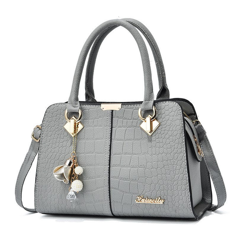 Top quality Brand High Quality New Style Free Delivery Designer Bag Middle aged fashionable women's handbag Korean version simple mother shoulder