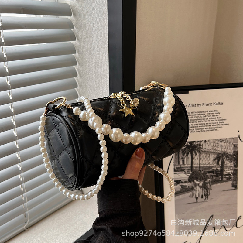 New summer single shoulder womens new pearl chain handbag simple and fashionable designer crossbody bag trendy cylindrical bag niche popular handbag c
