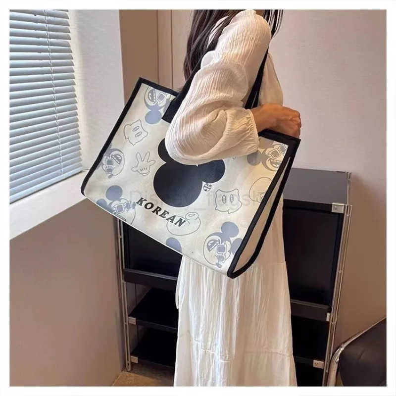 Disney 2024 New Mickey and Minnie Canvas Shoulder Bag Commuter Fashion Tote Bag Large Capacity Handbag Mommy BagXJ250515