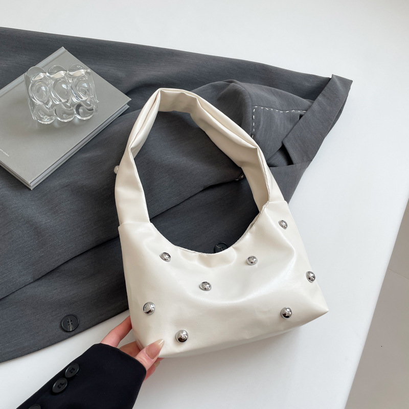Luxury Bag New Free Delivery Designer Bag High End Crowd 2025 Spring New Rivet Shoulder Handbag Women's Commuting Armpit Bag