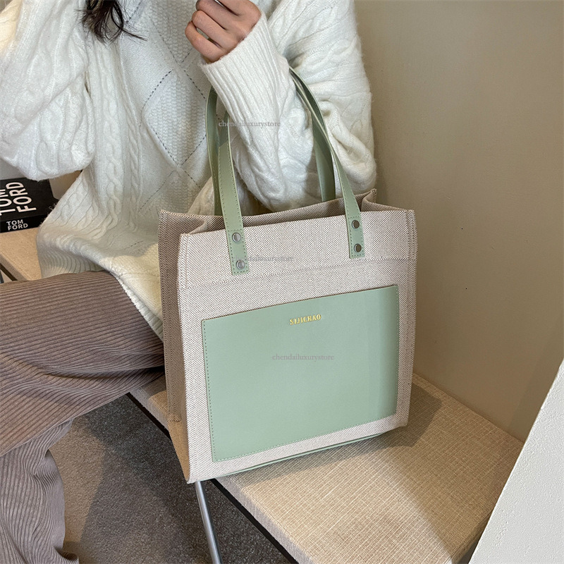 2025 Designer Bag Women's Large Capacity Comparison Canvas Upright Handbag New Letter Imprinted Commuter Shoulder Crossbody Bag Student Shopping 