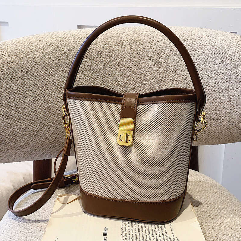 Niche retro for women 2025 high-end versatile, portable bucket spliced single shoulder crossbody bag, women's handbag new style, unique and elega
