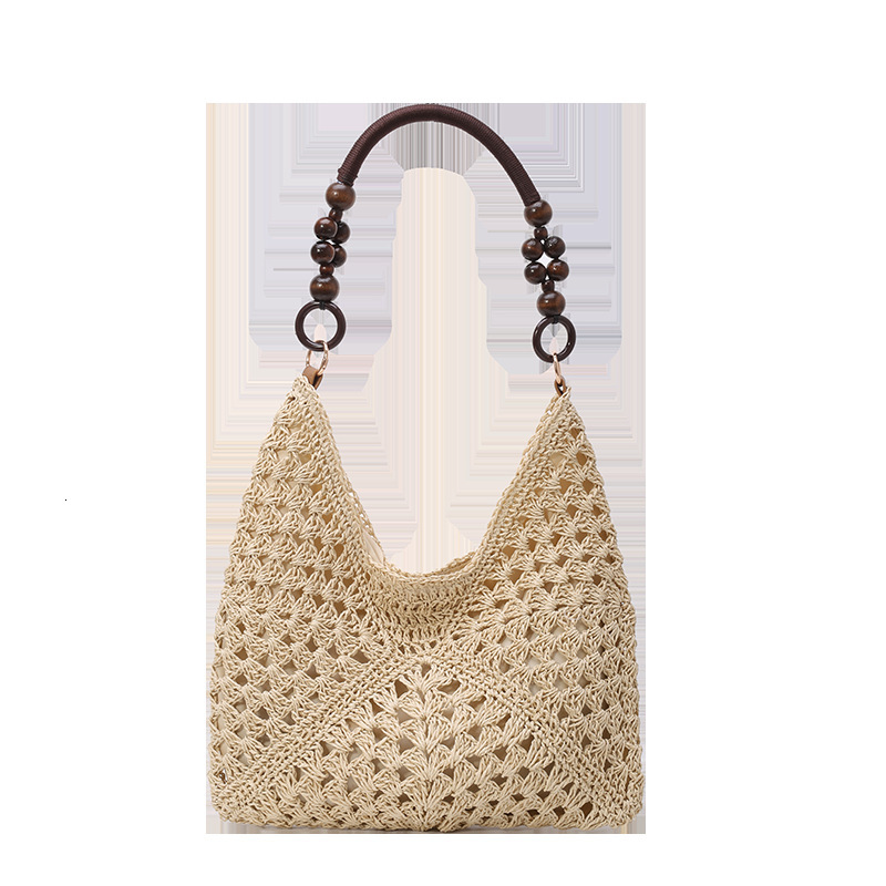 Hollow out fashionable casual grass armpit women 2025 summer new large capacity woven shoulder bag for work and commuting