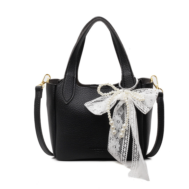 New high-end women's simple handbag for spring and summer with lychee pattern bow and ribbon designer single shoulder crossbody bag commuting sol