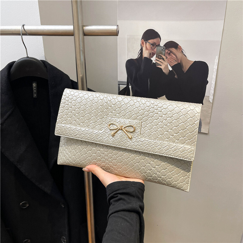 2025 New Urban Simple Fashion Trendy Bow New Free Delivery Designer Bag Luxury Bag Stone Pattern Bright Face Single Shoulder Underarm Small Square Wom