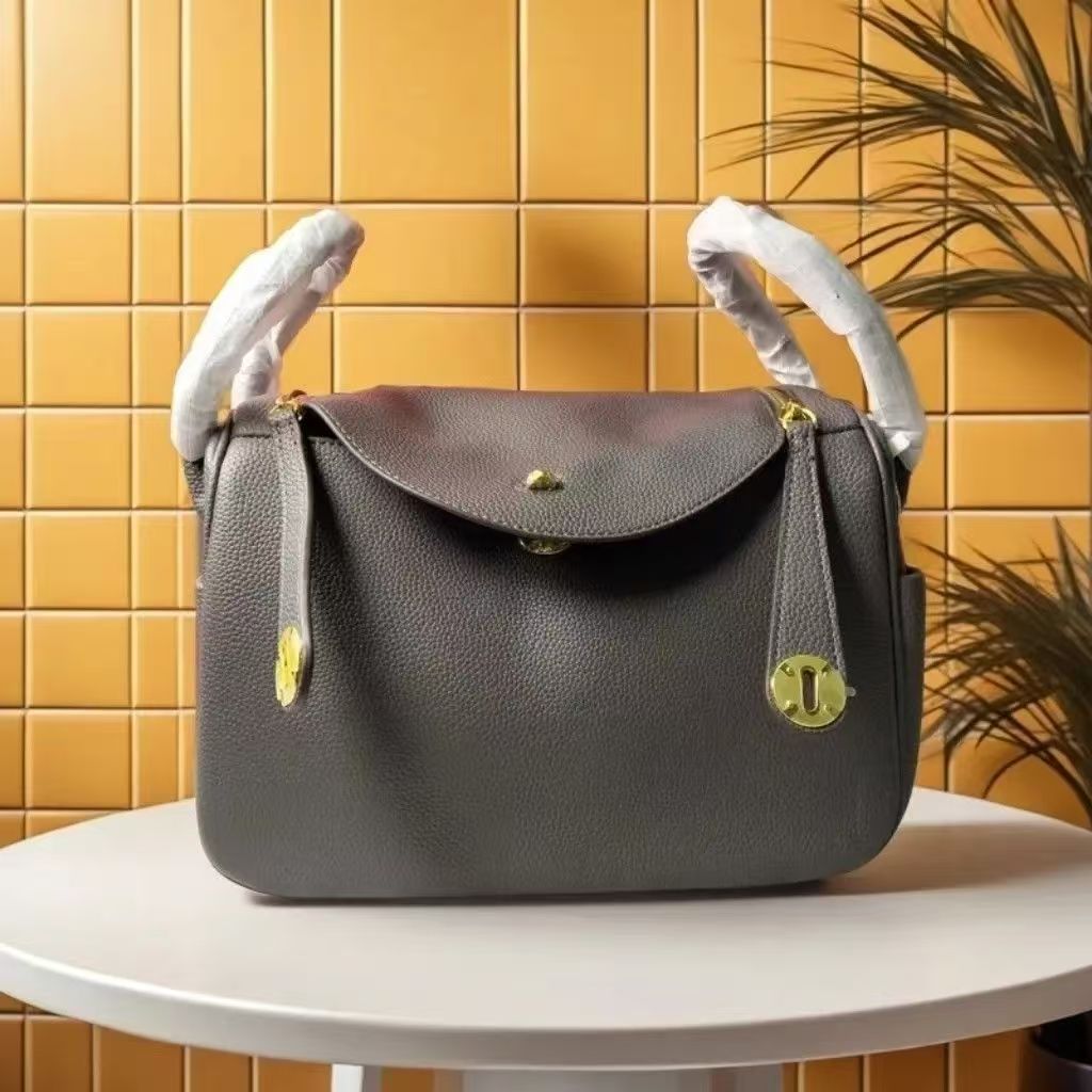 2025 new lychee grain cowhide womens bag large leather single shoulder crossbody bag silver buckle pillow tote bag versatile commuter handbag